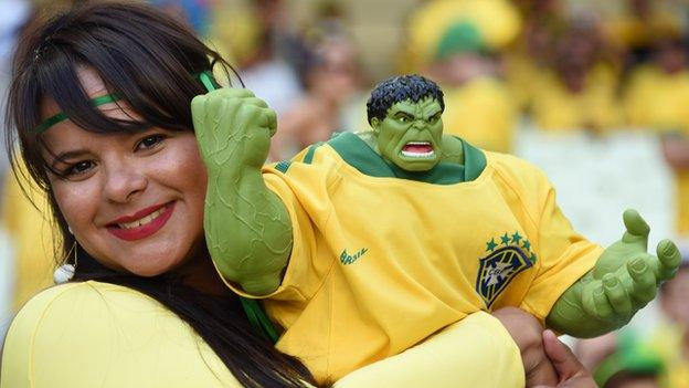 Brazil fan with hulk sculpture