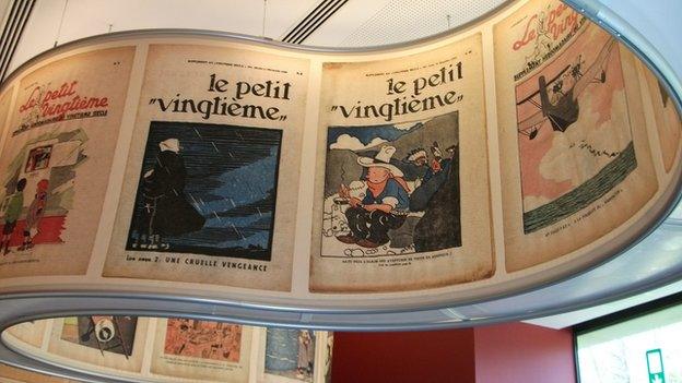 Early Tintin comic book covers on display