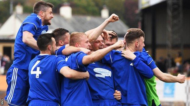 Cove celebrate after Jordon Brown scores Cove's sixth goal of the tie