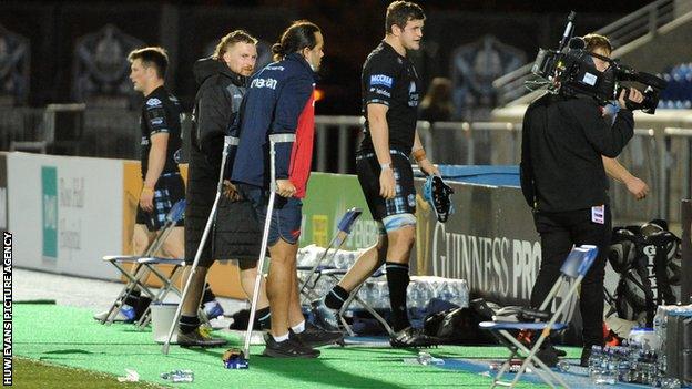 Josh Macleod leaves the pitch on crutches against Glasgow