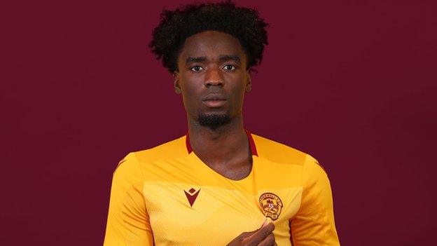 Motherwell make son of former Manchester United and England striker their seventh signing.