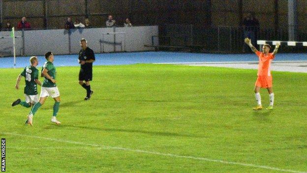 Guernsey FC goalkeeper Josh Addison celebrates winning the Skipton Cup