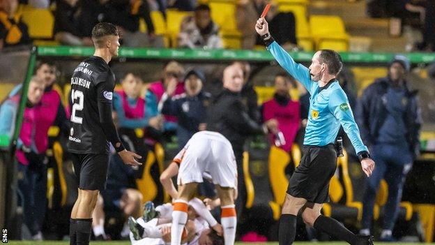 Livingston's Ben Williamson is sent off for a foul on Declan Glass