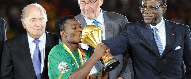 Chris Katongo prepares to lift the Africa Cup of Nations trophy for Zambia in 2012