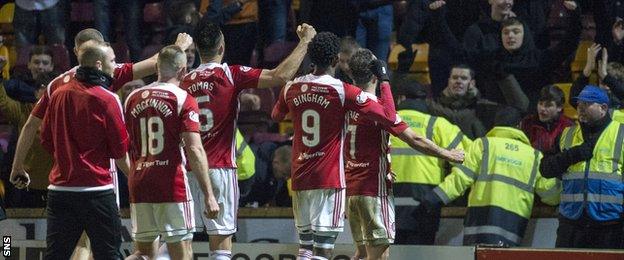 Hamilton Academical players and supporters celebrate beating Motherwell