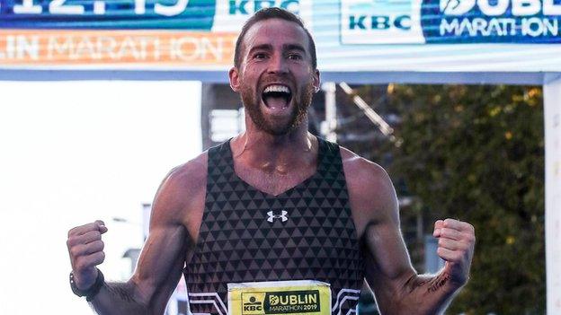 Stephen Scullion shows his delight after crossing the finishing line at the Dublin Marathon last October