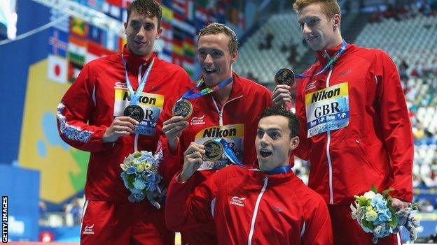 Gold medallists Dan Wallace, Robert Renwick, Calum Jarvis and James Guy of Great Britain pose during the medal ceremony for the Men's 4x200m Freestyle Relay at the World Championships