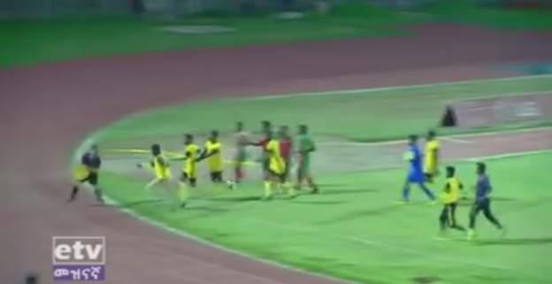 Welwalo Adigrat University chase down the referee after he awards a goal to opponents Defence