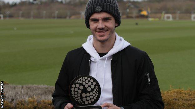 James Maddison shows off his EFL Young Player of the Month trophy