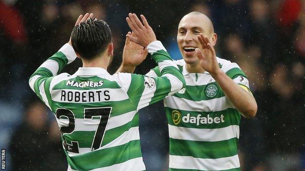 Scott Brown (right) high-fives team-mate Patrick Roberts