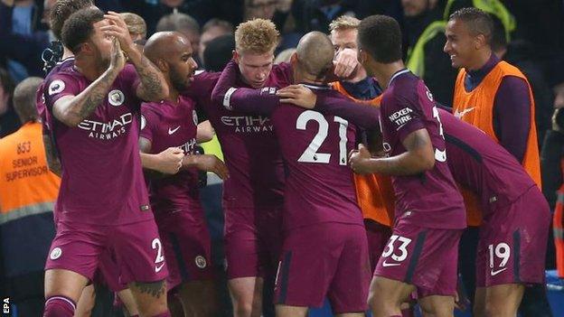 Manchester City celebrate scoring at Chelsea