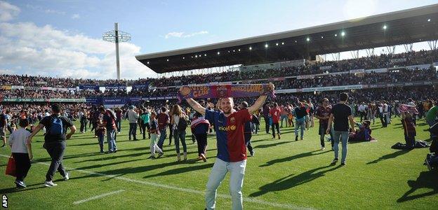 Fans invade the pitch