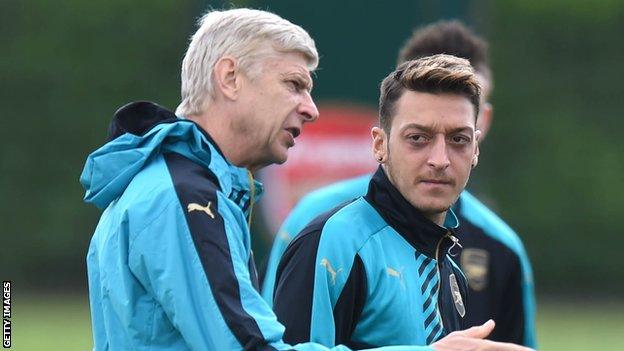 Arsene Wenger and Mesut Ozil