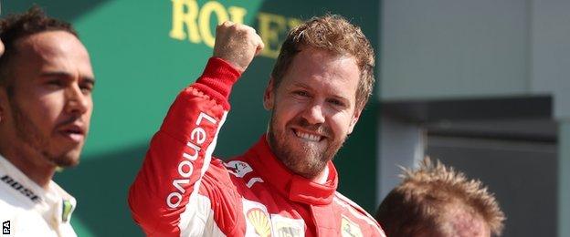 Ferrari"s Sebastian Vettel (centre) celebrates victory on the podium, with Mercedes" Lewis Hamilton (left) and Ferrari"s Kimi Raikkonen (right) during the 2018 British Grand Prix