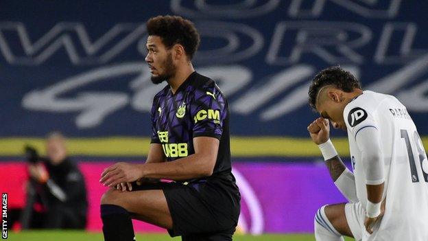 Newcastle and Leeds players take a knee before their Premier League match on Wednesday