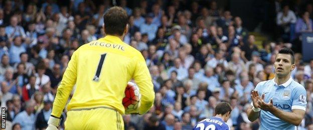 Asmir Begovic is applauded by Sergio Aguero