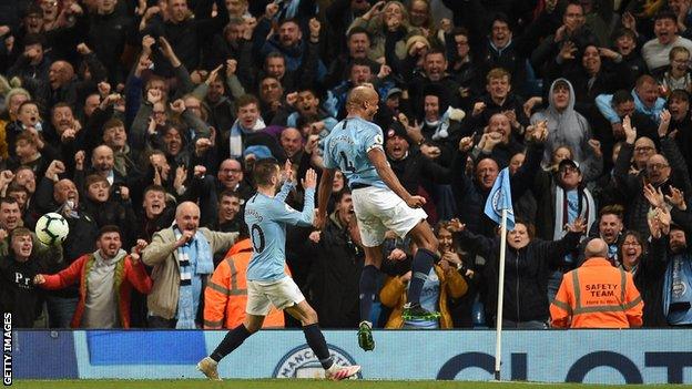 Kompany celebrates his goal against Leicester