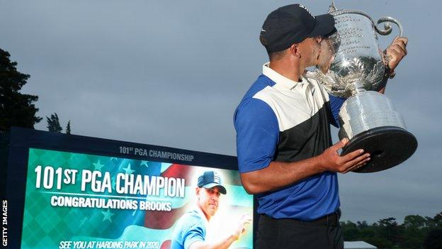 Brooks Koepka kisses the US PGA Championship trophy