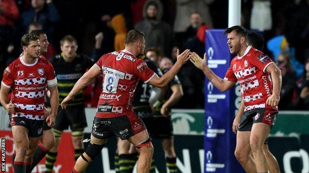 Gloucester players celebrate their win over Northampton