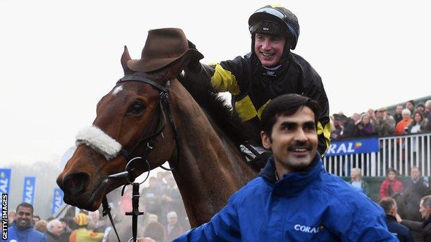 Jockey Tom O'Brien celebrates on Elegant Escape after winning the Welsh Grand National