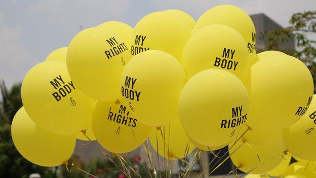 Amnesty International balloons reading "My body" and "My rights"