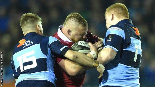 Scarlet prop Samson Lee runs into strong Cardiff Blues defence