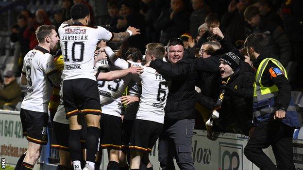 Scott Tiffoney (centre) scored the only goal of the game as Partick Thistle beat Queen of the South