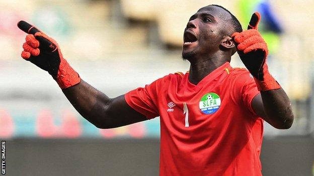 Mohamed Nbalie Kamara celebrates his clean sheet against Algeria