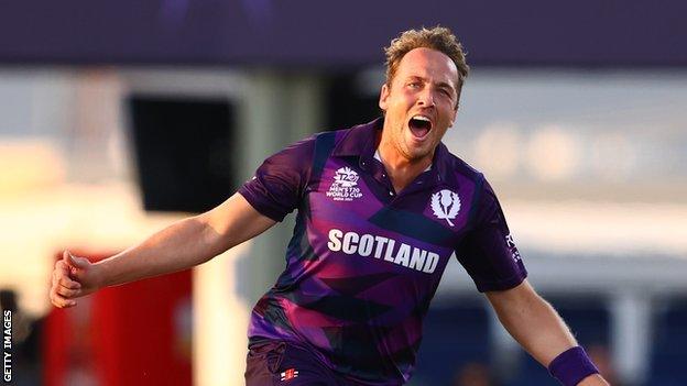 Scotland's Josh Davey takes a wicket against Papua New Guinea