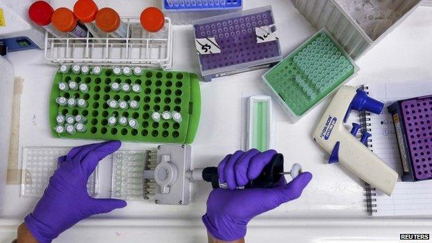 A scientist prepares protein samples for analysis in a lab