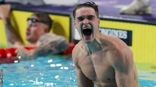 James Wilby celebrates his 100m breaststroke win