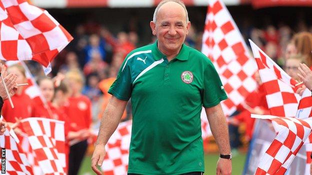 Tommy Breslin joins in with the celebrations at Solitude after guiding the Reds to the league title in 2014