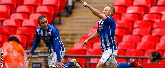 Chertsey Town's Jake Baxter (right) celebrates scoring the penalty that put his side 2-1 up in extra-time of the FA Vase final