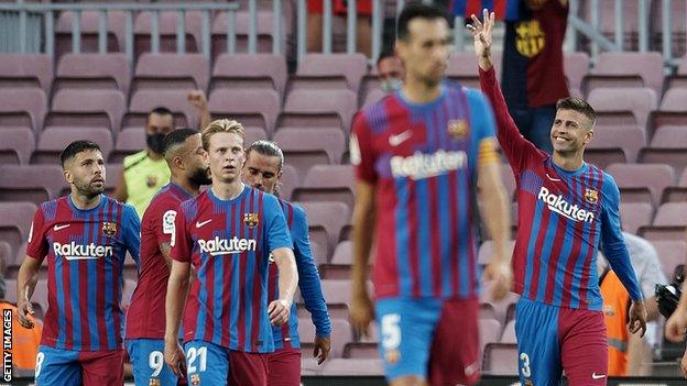 Gerard Pique celebrates