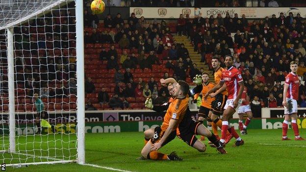 Diogo Jota slides in but clears the Barnsley crossbar from close range