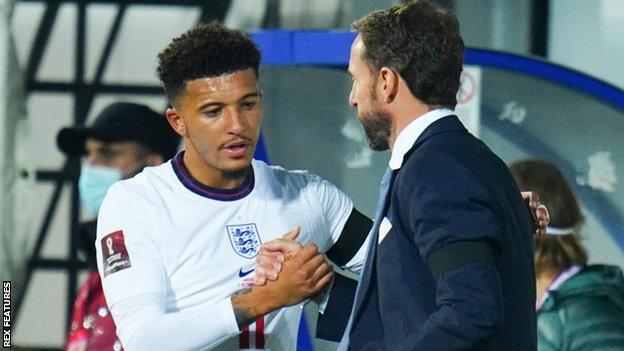England's Jadon Sancho with Gareth Southgate
