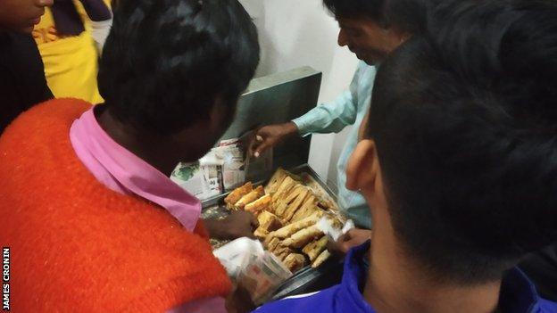 Fans tuck in to the half-time food