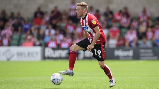 Joe Morrell playing for Lincoln City against Accrington Stanley