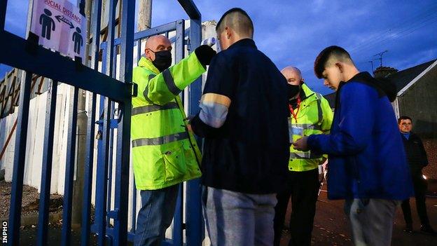 Fans attend Coleraine-Ballymena match