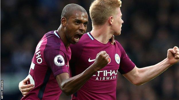 Manchester City midfielder Fernandinho (left)