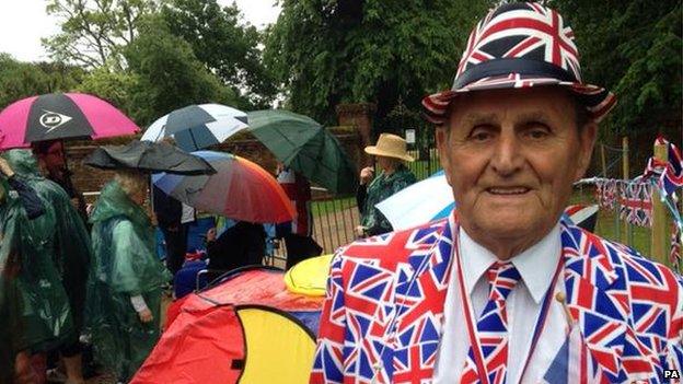 Terry Hutt, royal watcher, waits to see the Duke and Duchess arrive for the christening