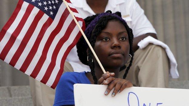 Woman holding the American flag