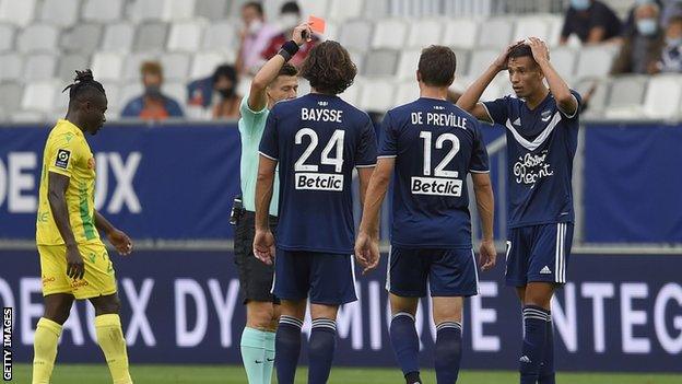 Bordeaux's French midfielder Mehdi Zerkane receives a red card