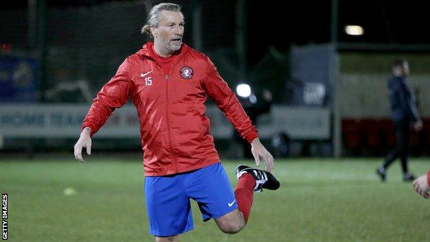 Robbie Savage warming up with Stockport Town