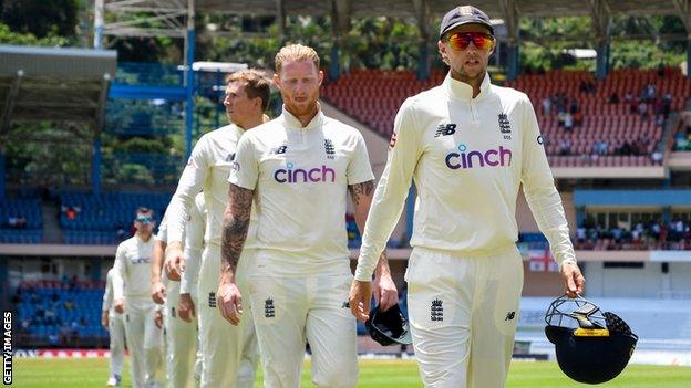 England's Joe Root (right) leads Ben Stokes (centre) and the rest of the team off the pitch following Test series defeat by West Indies