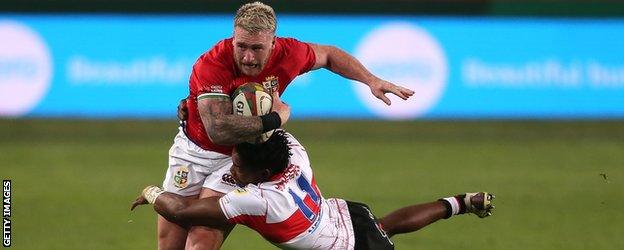 Stuart Hogg is tackled by a Sigma Lions player