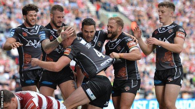Jake Trueman (furthest right) celebrates Michael Shenton's try
