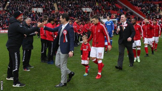 Former and current Charlton players walk out against Portsmouth at The Valley