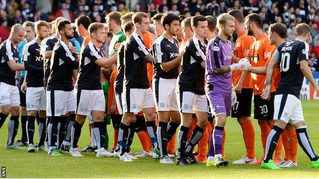 The two Dundee teams shake hands prior to kick-off