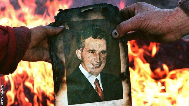 A photo of Nicolae Ceaușescu ready to be burned during the December 1989 Romanian revolution